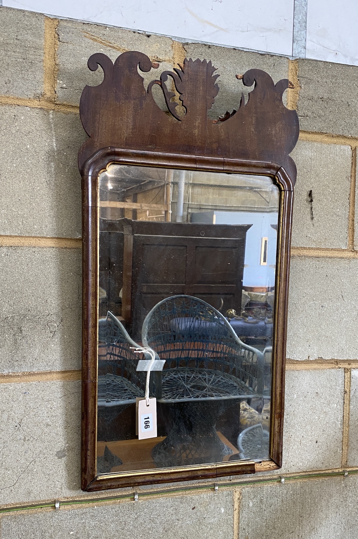 An 18th century walnut and parcel gilt wall mirror, width 39cm, height 74cm, NB: From the Estate of Rt Hon Lord Lawson of Blaby